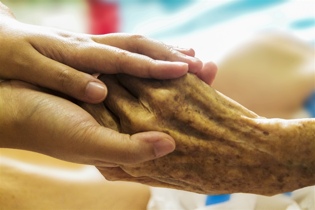 Holding an Elderly Hand with Care.jpg