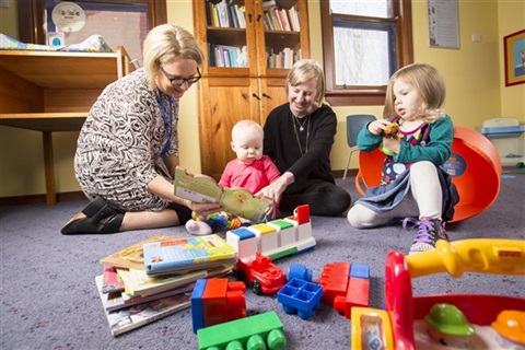 Maternal-and-Child-Health-nurse-playing-with-babies-and-mum